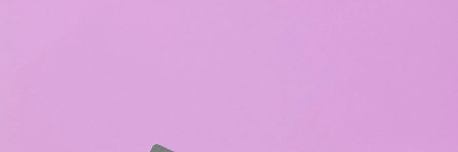 Payment cards and phone on a pink background